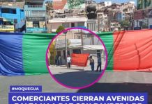 MOQUEGUA:  COMERCIANTES CIERRAN AVENIDAS BALTA Y LA PAZ CON BANDERA DE MOQUEGUA EN EL CERCADO.
